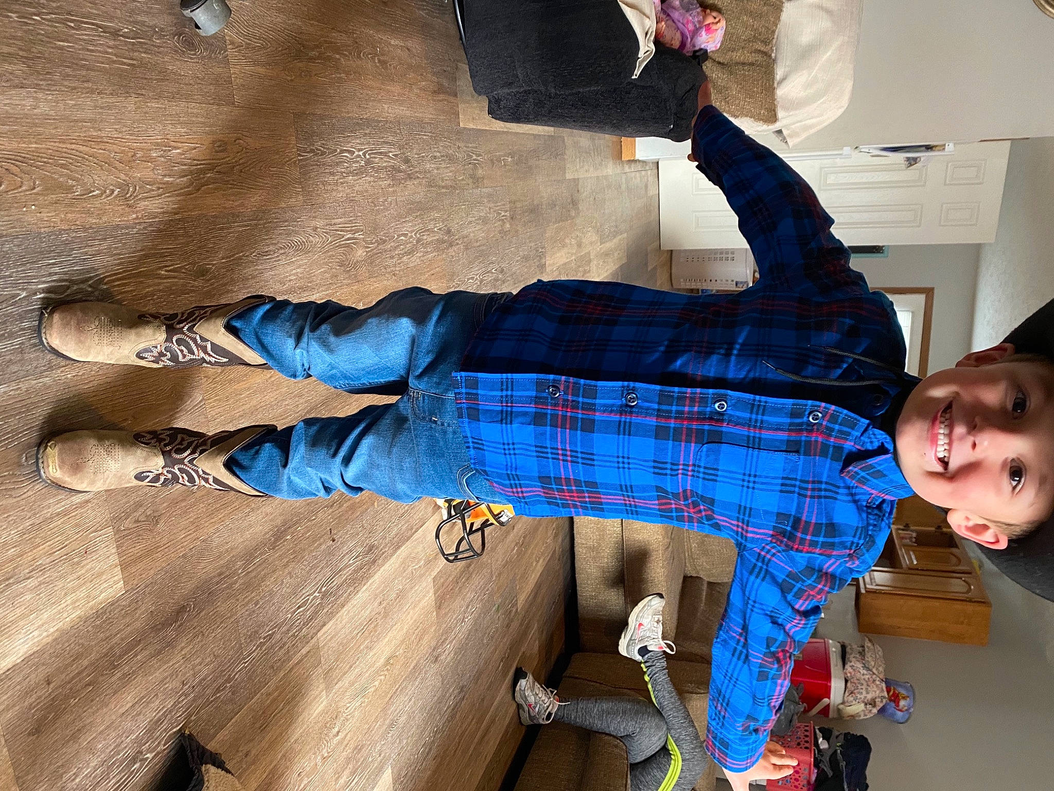 Koby is registered to the contest to win money with this photo: ankle, baby_toddler_clothing, cool, foot, headwear, human, human_leg, joy, knee, leg, outdoor_shoe, pattern, person, plaid, sandal, shadow, shoe, sneakers, sock, tartan