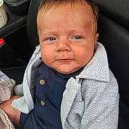Hunter joined the competition — help win amazing prizes! baby, child, face, expression, blue_eyes, clothing, jacket, car_seat, seat, buttoned_shirt, texture, human, infant, portrait, closeup, indoor, casual, sitting, cozy, cute