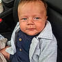 baby, child, face, expression, blue_eyes, clothing, jacket, car_seat, seat, buttoned_shirt, texture, human, infant, portrait, closeup, indoor, casual, sitting, cozy, cute