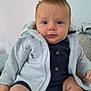 Hunter joined the competition — help win amazing prizes! baby, infant, child, blue_eyes, clothing, jacket, sitting, cute, portrait, indoor, drool, hair, face, person, skin, button, comfort, young, hoodie, expression