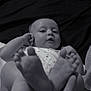 baby, infant, feet, hand, black_and_white, portrait, lying_down, clothing, fabric, bed, blanket, skin, cute, child, person, small, human, closeup, relaxing, indoor