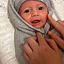 Scott joined the competition — help win amazing prizes! baby, towel, hands, face, hood, eyes, mouth, skin, infant, newborn, blanket, pattern, animal_print, star, changing_pad, soft_texture, comfort, cute, indoor, child