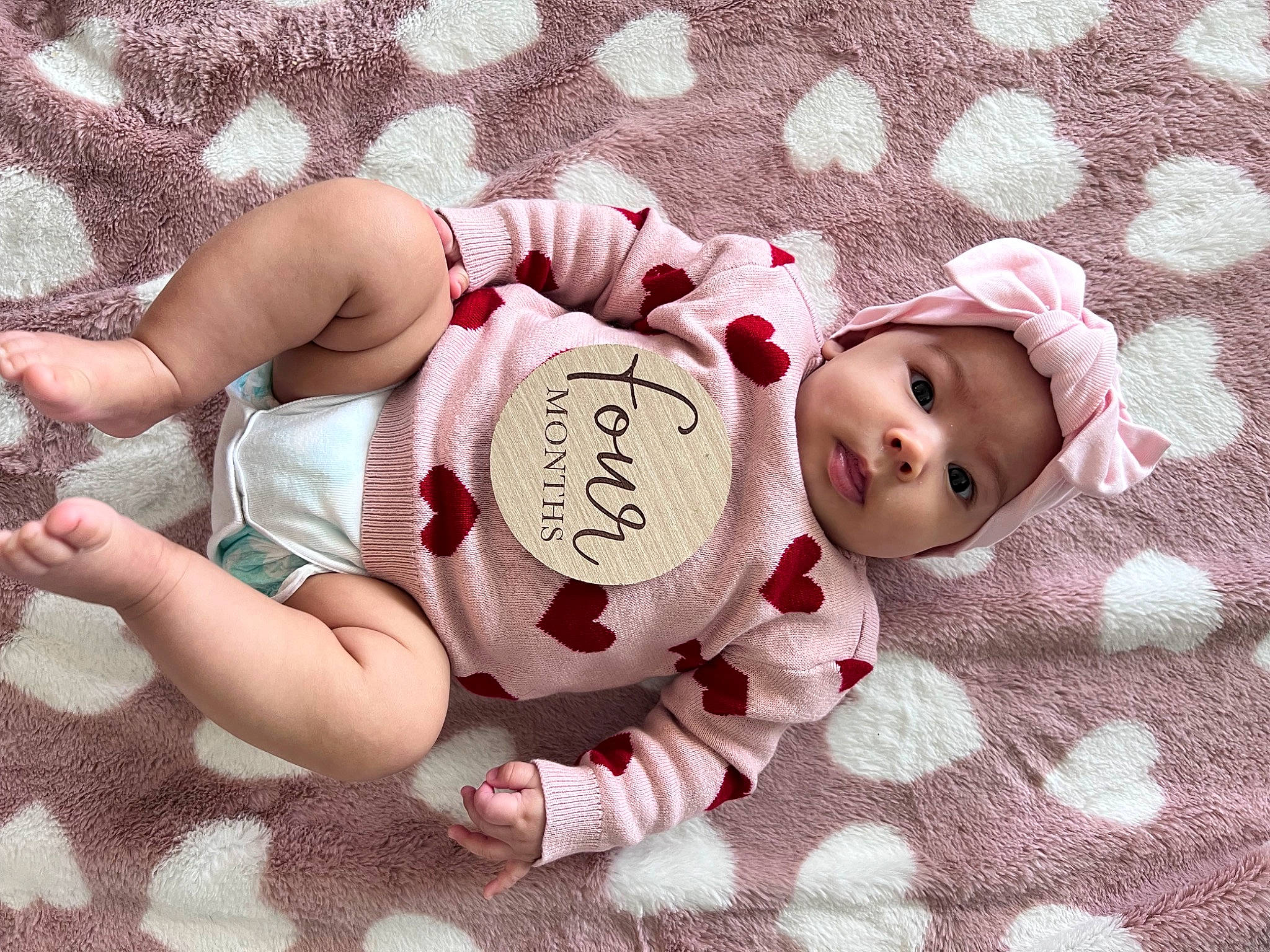 Violet is registered to the contest to win money with this photo: baby, baby_products, baby_sleeping, baby_toddler_clothing, beauty, carmine, child, comfort, fashion_accessory, font, foot, happy, headgear, headwear, pattern, person, pink, product, sleeve, textile
