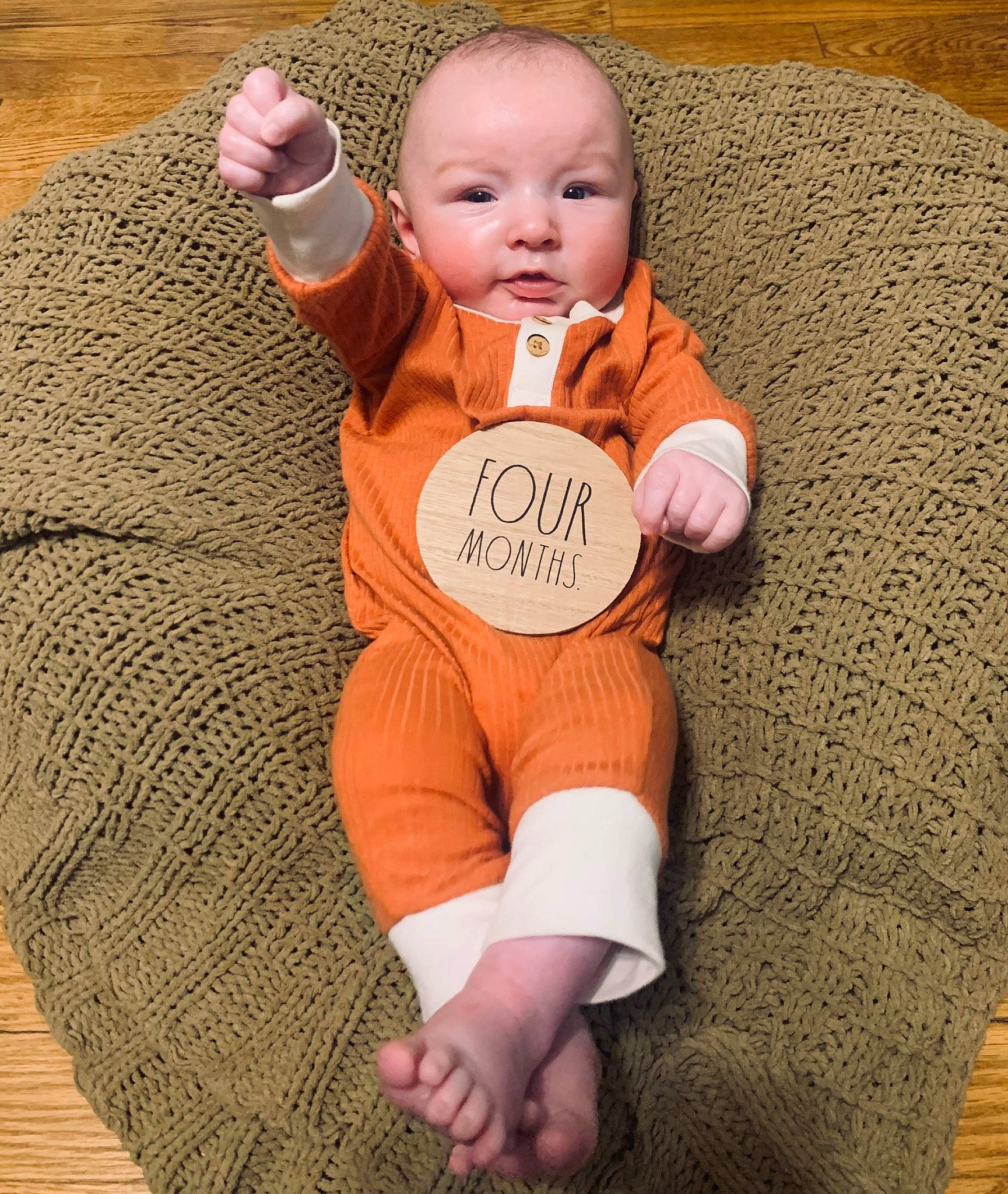 Kaysen joined the competition — help win amazing prizes! arm, baby, baby_toddler_clothing, cheek, comfort, eye, face, finger, gesture, hand, happy, head, human_body, orange, person, skin, sleeve, smile, textile, toddler