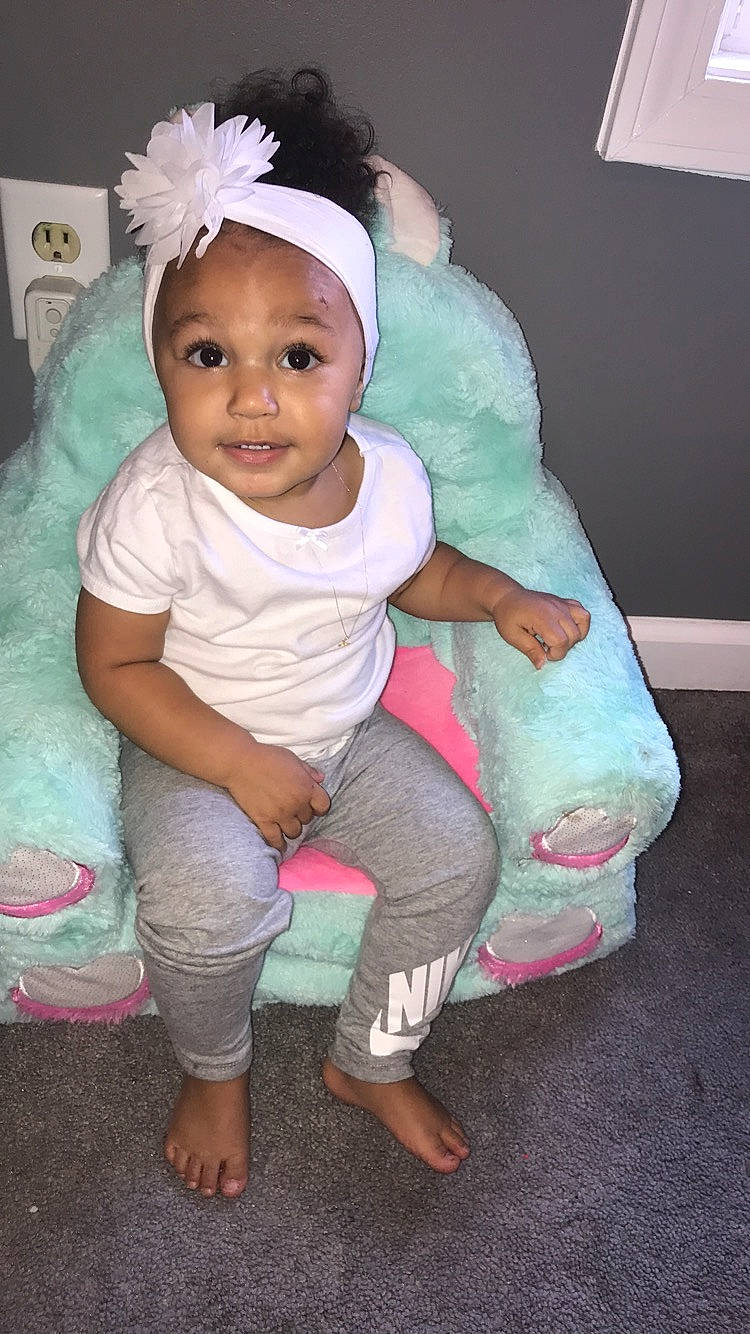 Milani is registered to the contest to win money with this photo: baby, baby_toddler_clothing, cheek, child, headgear, person, pink, skin, smile, toddler