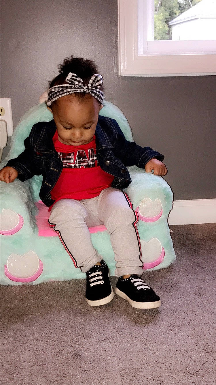 Milani is registered to the contest to win money with this photo: baby, black_hair, cheek, child, cool, footwear, hair_accessory, hairstyle, headband, headgear, person, pink, play, shoe, sitting, skin, toddler, white