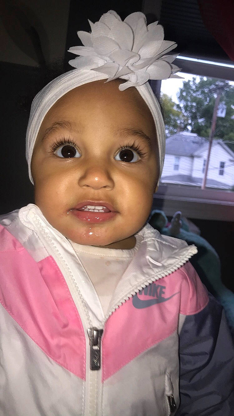 Milani is registered to the contest to win money with this photo: cheek, child, face, forehead, head, headgear, lip, person, pink, toddler