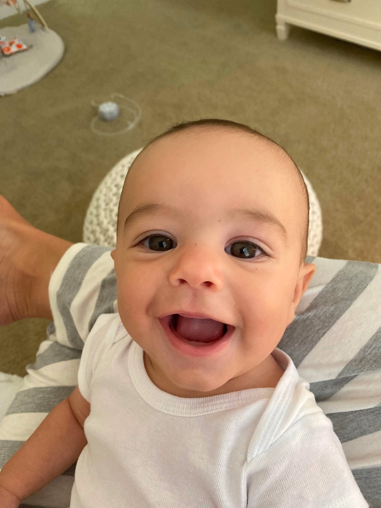 Kodi is registered to the contest to win money with this photo: baby, baby_toddler_clothing, cheek, chin, eye, eyebrow, face, finger, gesture, happy, head, iris, joy, lip, mouth, neck, nose, person, skin, sleeve