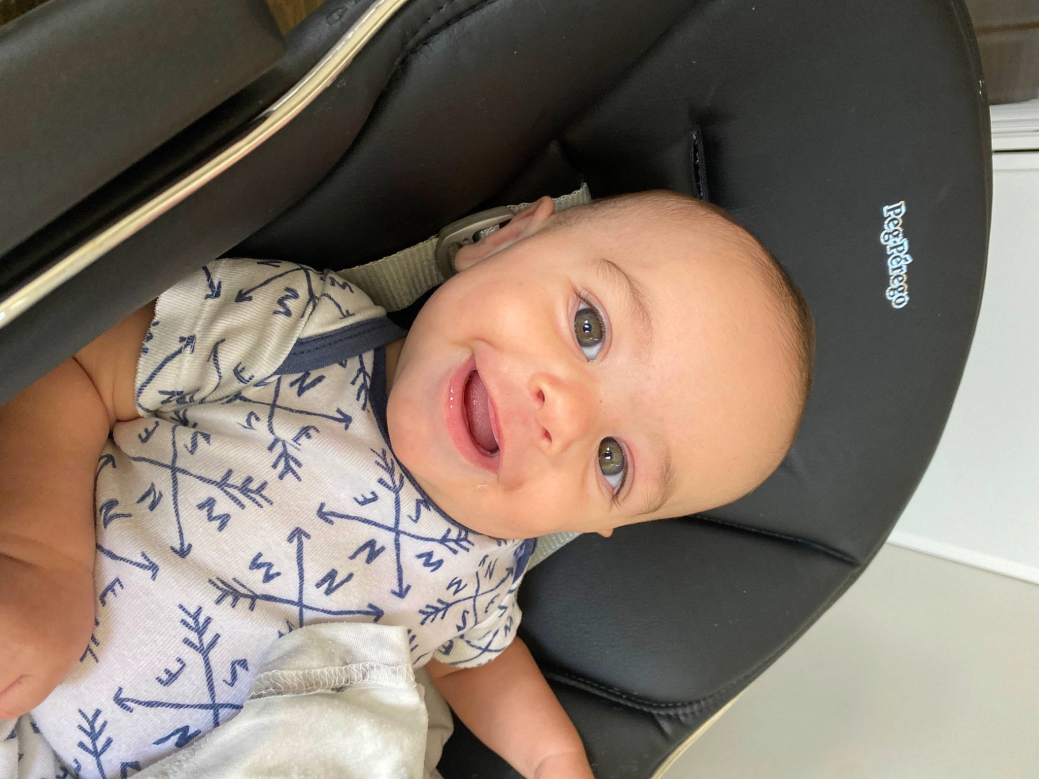Kodi is registered to the contest to win money with this photo: auto_part, automotive_design, baby, baby_products, baby_toddler_clothing, car_seat, cheek, child, comfort, eye, flash_photography, fun, happy, mouth, nose, person, sitting, skin, sleeve, smile