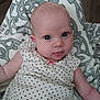 Maya joined the competition — help win amazing prizes! arm, baby, blanket, child, clothing, comfort, cute, expression, eyes, face, head, heart_pattern, indoors, infant, lying_down, pattern, person, skin, soft_texture, tongue