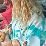 Stormy Faye is registered to the contest to win money with this photo: puppy, dog, person, hoodie, tie_dye, car_interior, driver, window, road, blond_hair, man, pet, relaxing, sleeping, casual_clothing, seat, hand, side_view, transport, daytime
