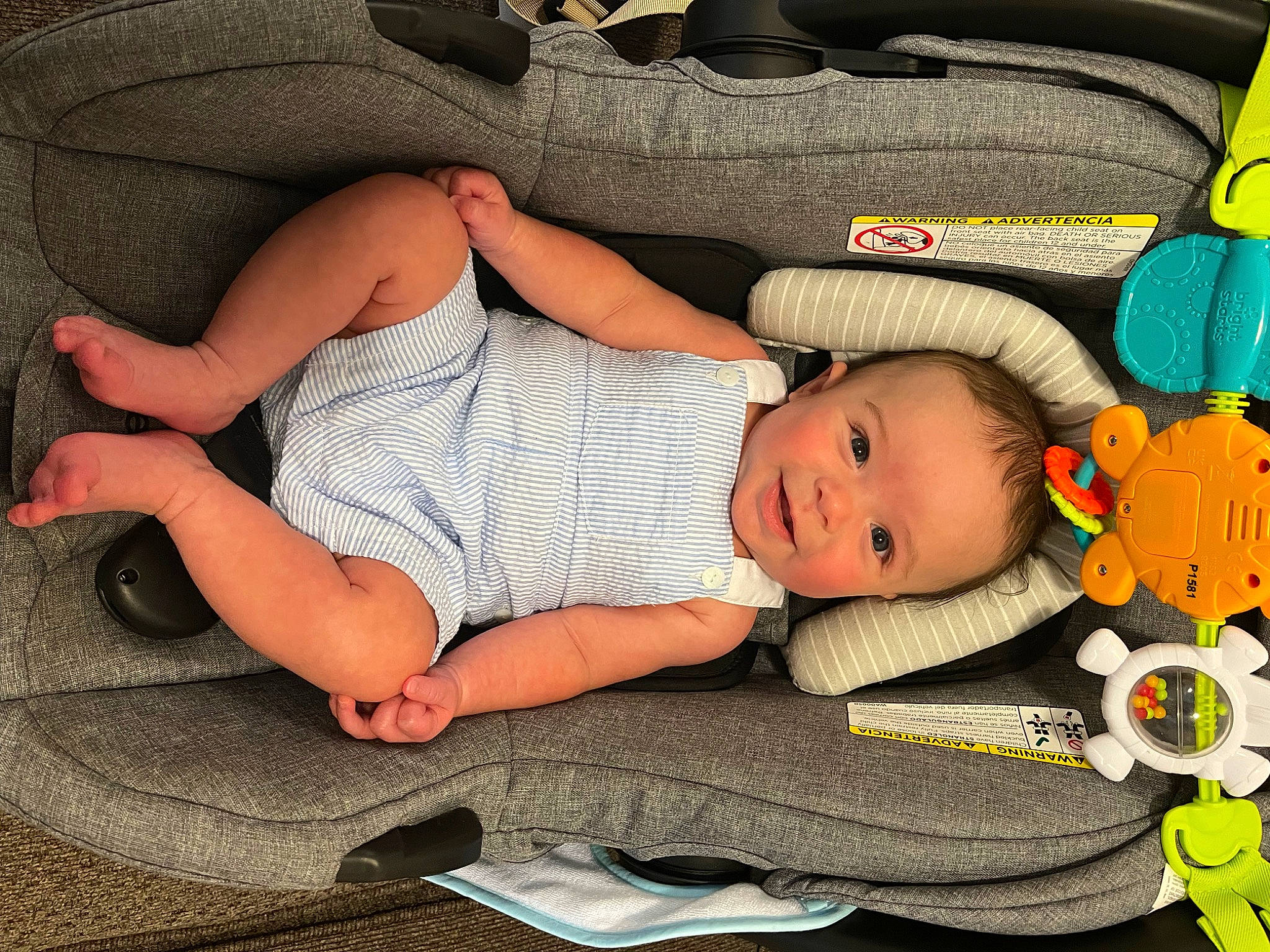 Fisher is registered to the contest to win money with this photo: arm, baby, baby_products, baby_toddler_clothing, beauty, cheek, child, comfort, finger, hand, head, human_body, human_leg, lap, leg, linens, pattern, person, textile, thigh