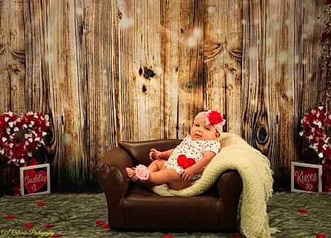 Milah is registered to the contest to win money with this photo: christmas, christmas_decoration, christmas_ornament, comfort, couch, event, flash_photography, grass, happy, leisure, magenta, ornament, people, person, plant, red, room, sitting, toddler, tree