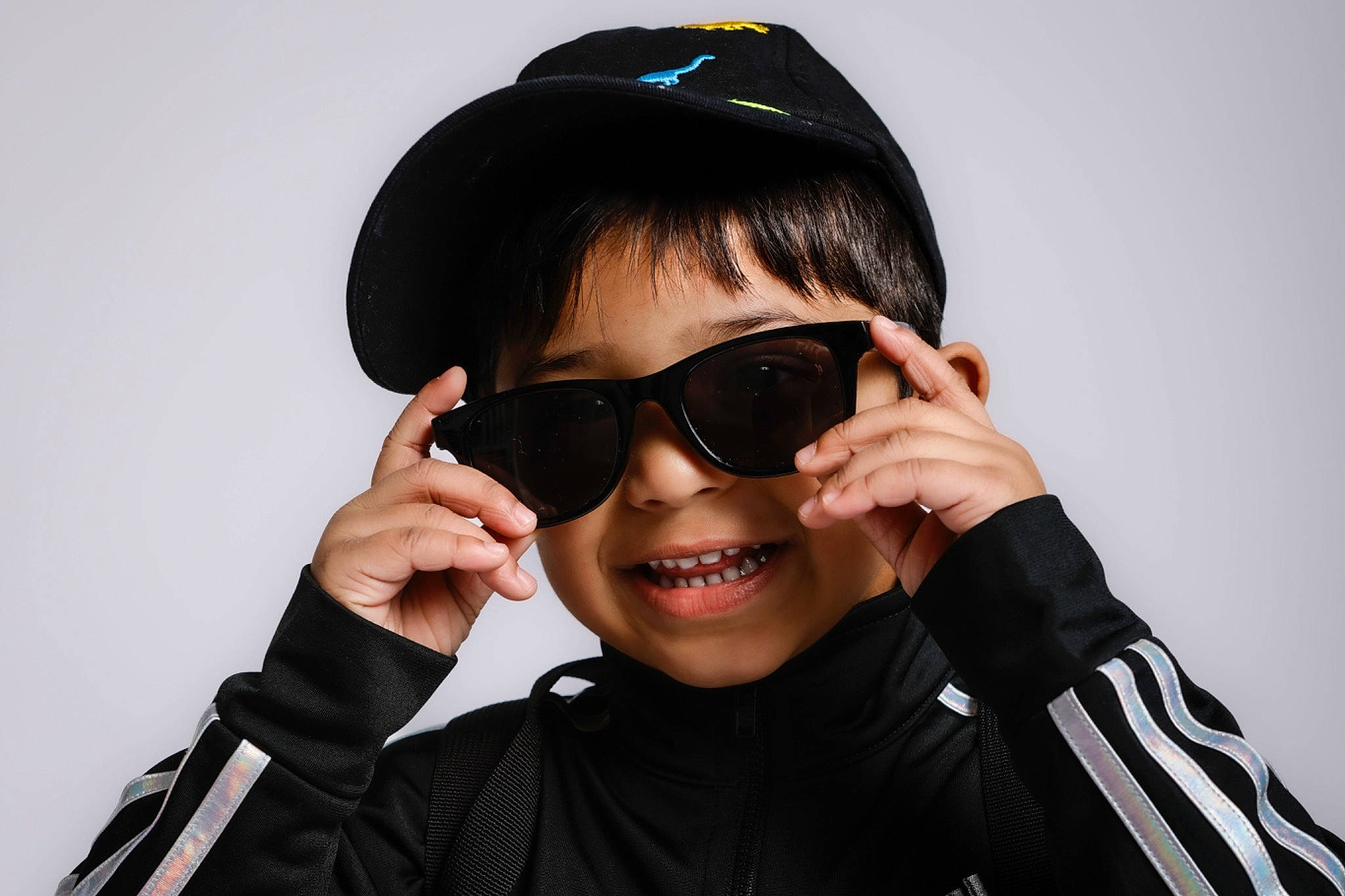 Raegan Joshy joined the competition — help win amazing prizes! black_hair, chin, cool, eye_glass_accessory, eyebrow, eyewear, finger, flash_photography, gesture, goggles, happy, jaw, joy, lip, neck, outerwear, person, personal_protective_equipment, sleeve, smile
