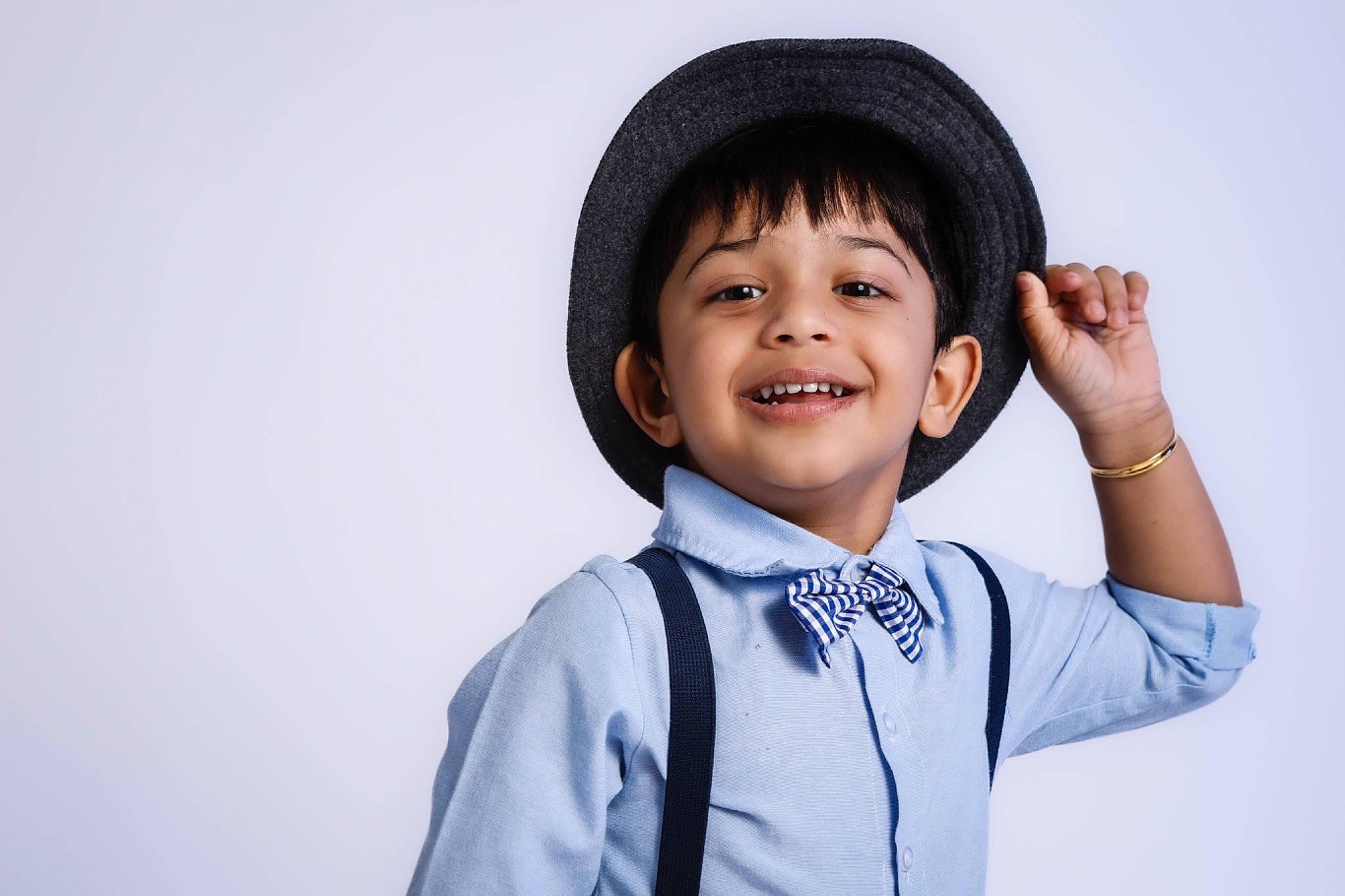 Raegan Joshy joined the competition — help win amazing prizes! cap, child, chin, collar, electric_blue, eye, face, fashion_accessory, flash_photography, fun, gesture, happy, hat, joy, laugh, outerwear, person, portrait_photography, sleeve, smile