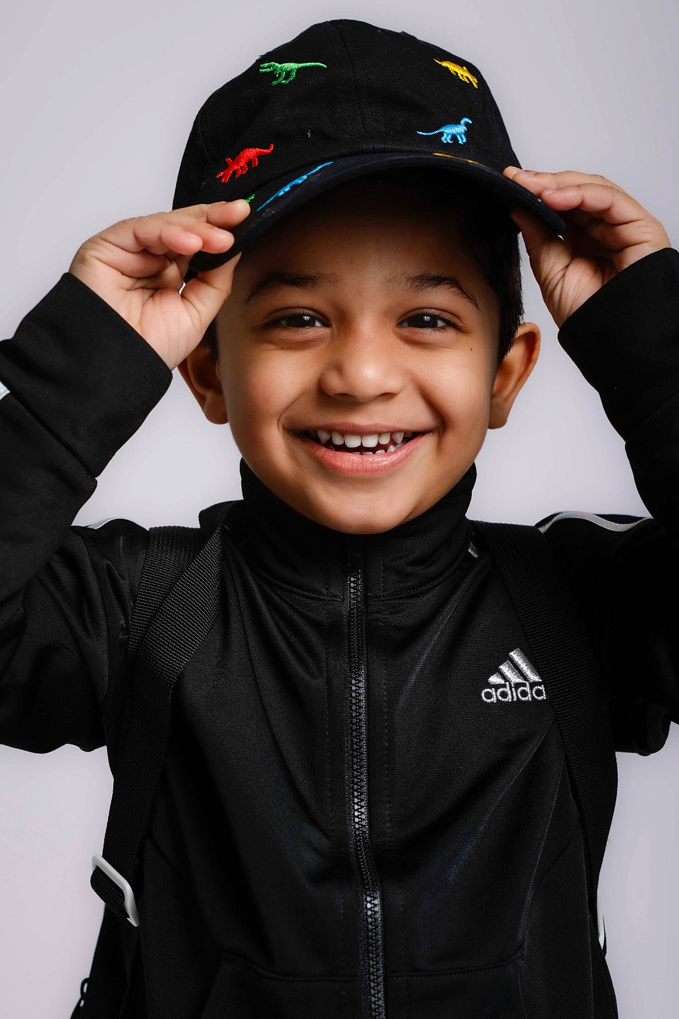 Raegan Joshy joined the competition — help win amazing prizes! baseball_cap, cap, child, clothing, cool, cricket_cap, electric_blue, facial_expression, fashion_accessory, flash_photography, forehead, gesture, happy, headgear, headwear, joy, outerwear, person, personal_protective_equipment, sleeve