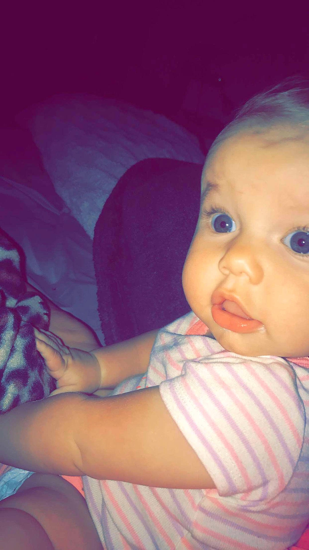 Jessie is registered to the contest to win money with this photo: beauty, black_hair, cheek, child, close_up, eye, face, forehead, girl, head, human_hair_color, infant, lip, mouth, nose, person, pink, purple, skin, smile