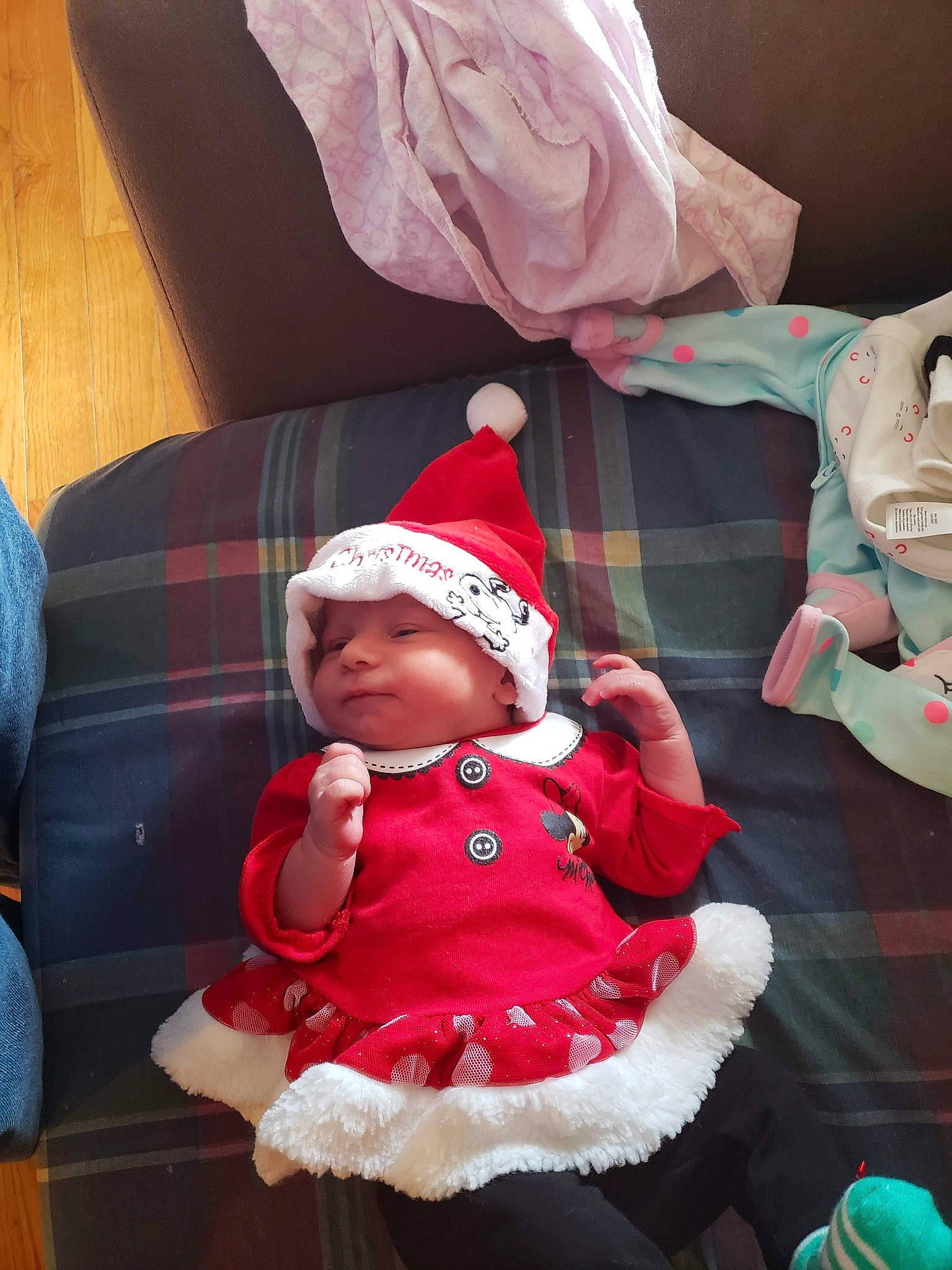Aryanna is registered to the contest to win money with this photo: child, christmas, fun, headwear, holiday, infant, lap, person, product, red, santa_claus, skin, smile, textile, toddler