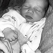 Remi joined the competition — help win amazing prizes! baby, newborn, sleeping, hand, blanket, clothing, cozy, infant, portrait, closeup, soft_texture, monochrome, peaceful, cute, child, rest, warm, toddler, human, face