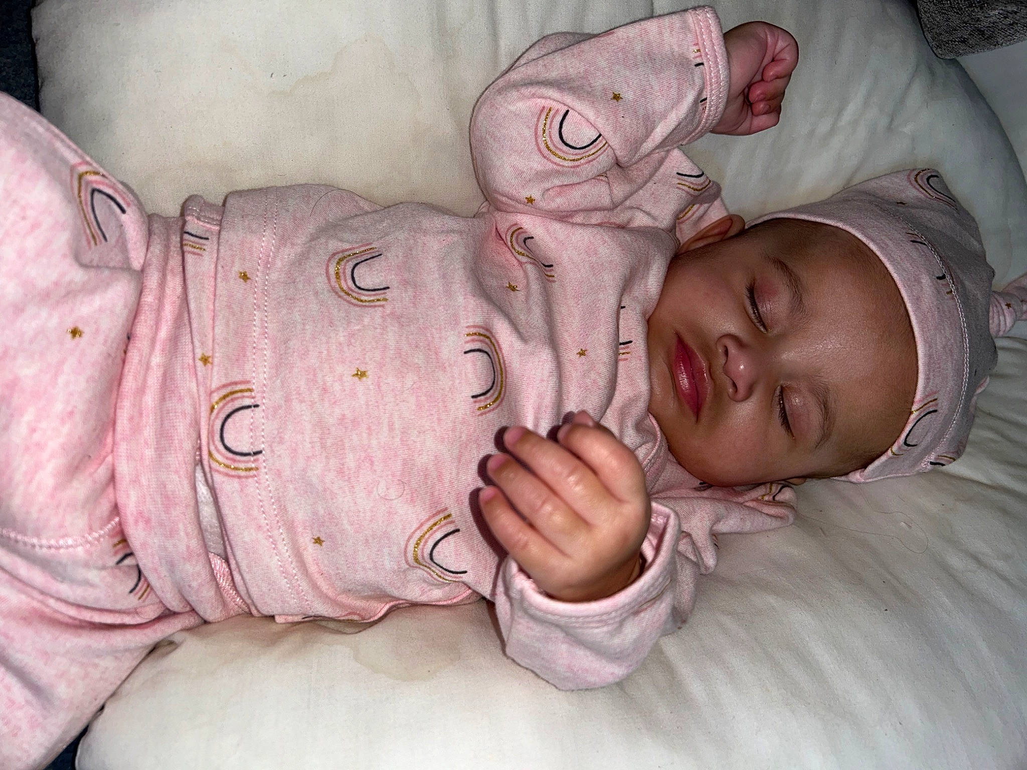 Karmella is registered to the contest to win money with this photo: arm, baby, baby_toddler_clothing, cheek, comfort, ear, eye, finger, gesture, hand, human_body, iris, linens, mouth, nose, person, pink, skin, sleeve, textile