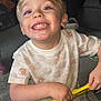Cameron is registered to the contest to win money with this photo: child, boy, smiling, toy, yellow_bus, indoor, carpet, blue_eyes, short_hair, happy, playing, casual_clothing, closeup, cute, preschooler, hands, teeth, light_skin, cheerful, fun