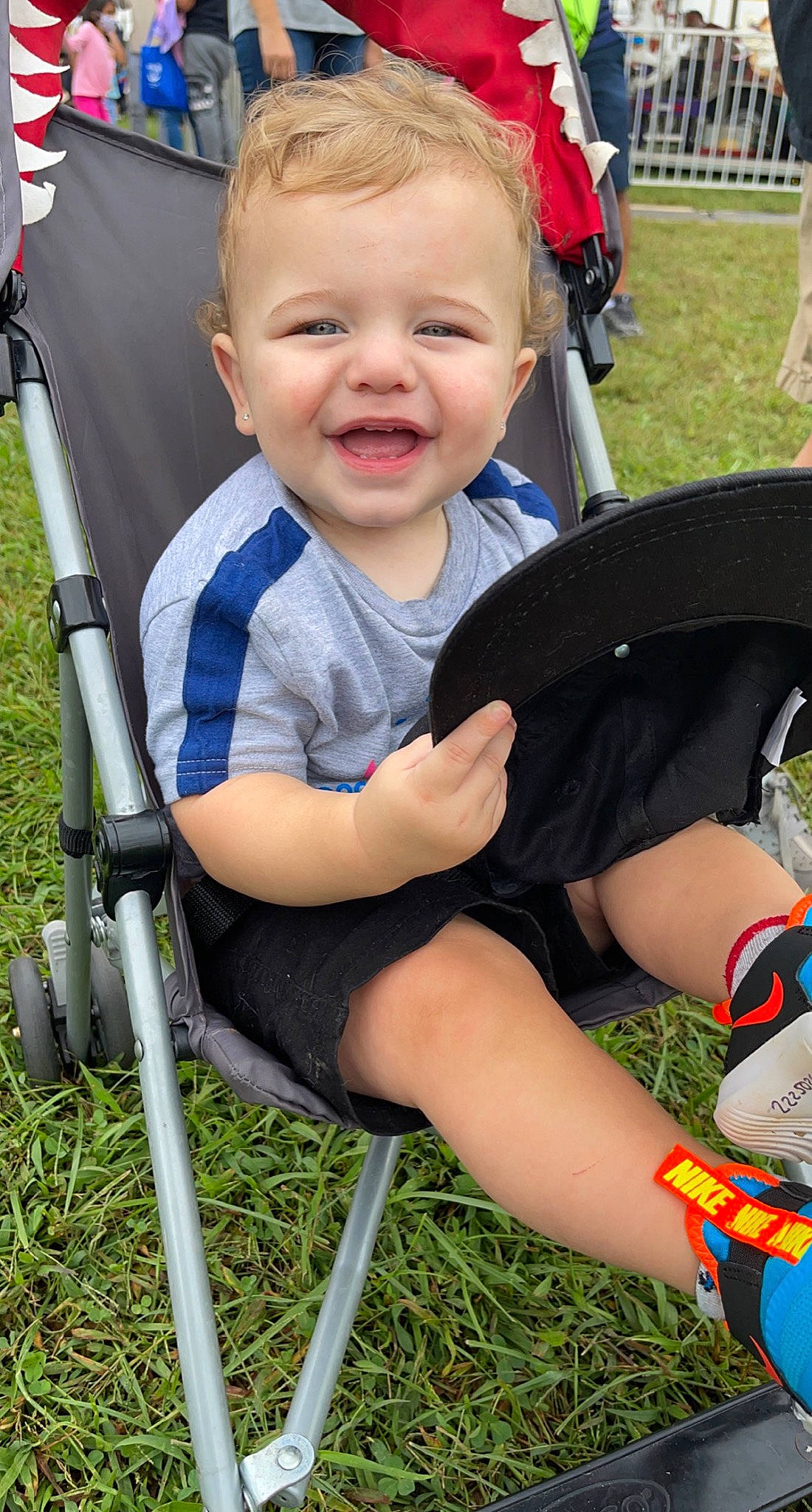 Krew joined the competition — help win amazing prizes! baby, chair, child, eye, facial_expression, fun, grass, green, lap, lawn, leisure, person, plant, product, shorts, skin, smile, summer, thigh, toddler