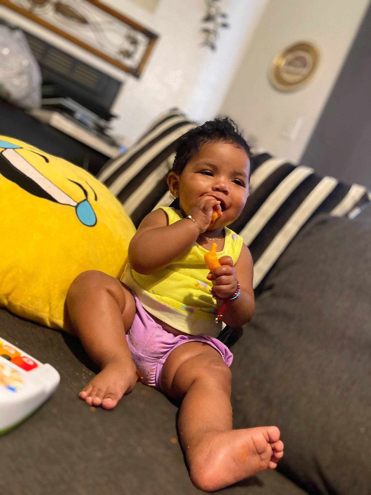 Xyah is registered to the contest to win money with this photo: abdomen, baby, child, couch, event, finger, foot, fun, happy, head, human_leg, leg, leisure, mouth, person, picture_frame, room, skin, thigh, toddler