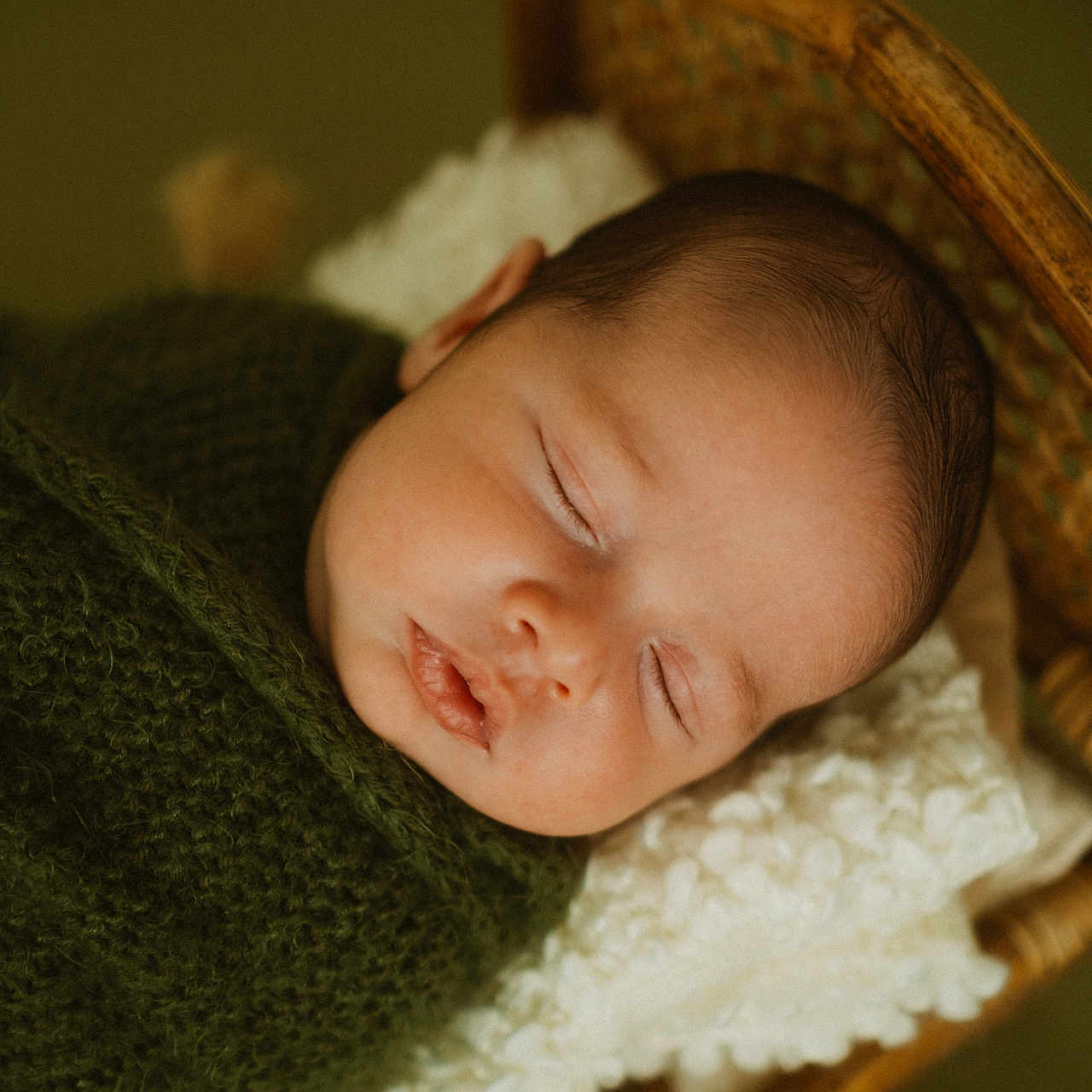 Mateo is registered to the contest to win money with this photo: baby, bed, blanket, bonnet, clothing, cradle, crib, face, furniture, hat, head, infantbed, knitwear, newborn, person, photography, portrait, sleeping, sweater, towel