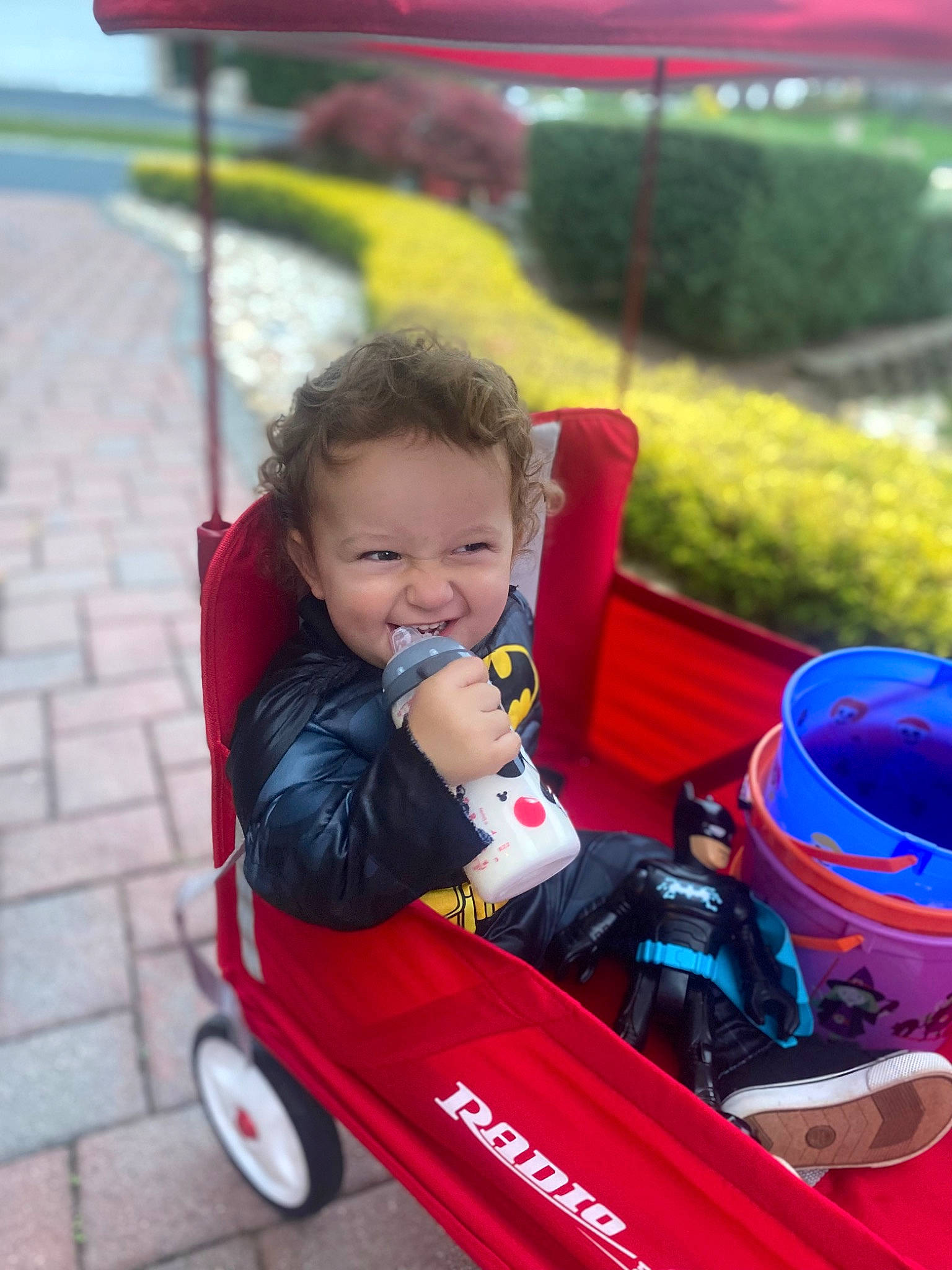Matteo joined the competition — help win amazing prizes! automotive_wheel_system, baby, baby_toddler_clothing, child, fun, grass, happy, leisure, motor_vehicle, person, plant, play, recreation, riding_toy, sitting, smile, tire, toddler, toy, vehicle