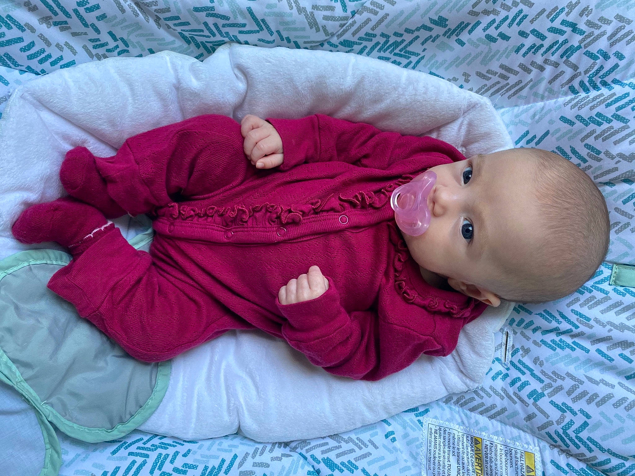 Adley is registered to the contest to win money with this photo: baby, baby_products, baby_sleeping, baby_toddler_clothing, bedtime, cheek, child, comfort, face, head, headgear, linens, magenta, person, pink, product, purple, sitting, sleeve, textile
