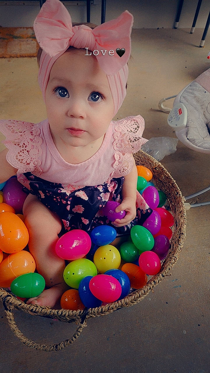 Evangeline joined the competition — help win amazing prizes! baby_toddler_clothing, ball, child, clothing, easter, event, eyelash, facial_expression, fun, happy, headband, headpiece, headwear, party_supply, pattern, person, pink, play, sweetness, toddler