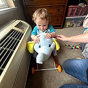 Hunter joined the competition — help win amazing prizes! air_conditioner, carpet, child, clothing, colorful_toy, dresser, elephant, hand, happy, home, indoor, jeans, laundry_basket, person, plush_toy, ride_on_toy, smiling, toddler, toy, window
