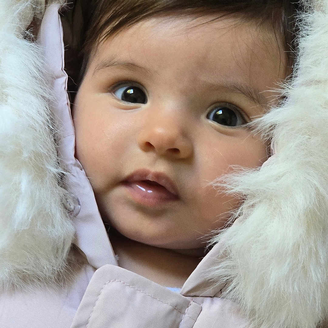 Sabine joined the competition — help win amazing prizes! baby, child, closeup, curious, cute, eyelashes, face, fur, fur_hood, hood, innocent, jacket, outdoor_wear, portrait, skin, small_lips, soft_texture, warm, winter_clothing, young