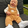 Briceson joined the competition — help win amazing prizes! baby, booties, chair, child, close_up, clothing, cozy, cushion, face, fleece, garden, happy, infant, outdoor, playful, portrait, romper, sitting, smiling, white_shoes