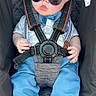 baby, blue_clothing, bow_tie, car_seat, child, cute, face, fashion, hands, harness, head, indoors, infant, photography, portrait, pout, safety_belt, seated, sunglasses, vehicle