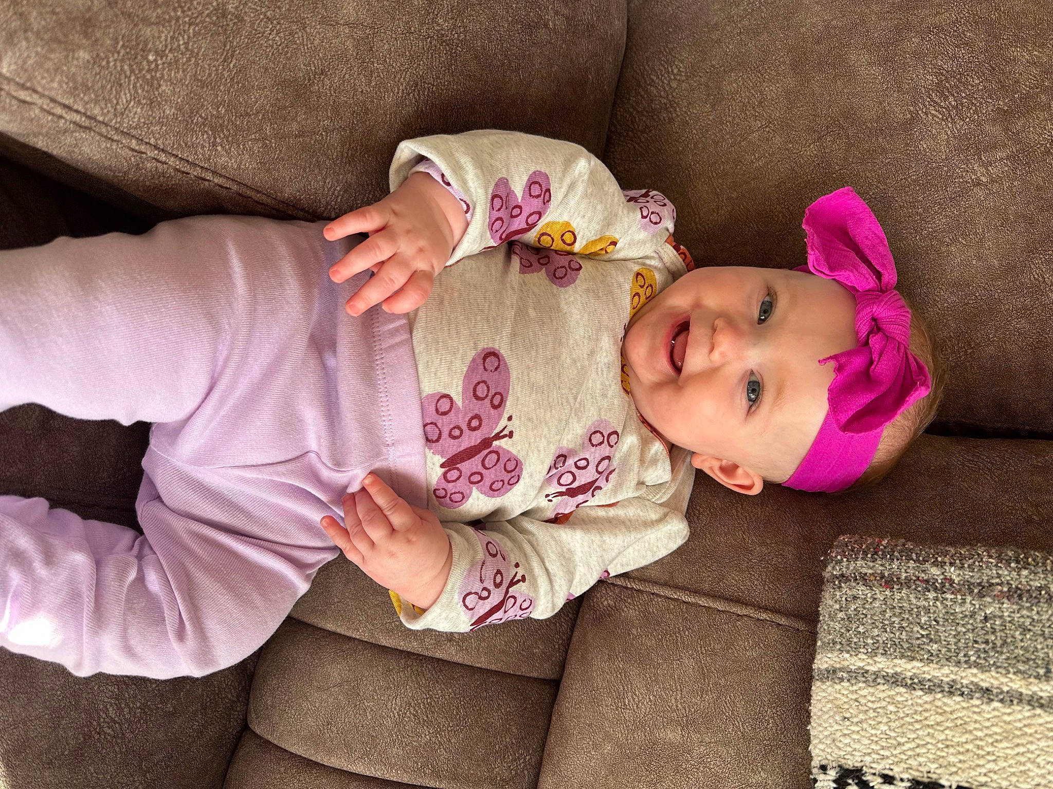 Skylar is registered to the contest to win money with this photo: baby, baby_toddler_clothing, cheek, comfort, eye, face, facial_expression, glasses, head, headwear, human_body, joy, leg, lip, mammal, nose, outerwear, person, pink, purple