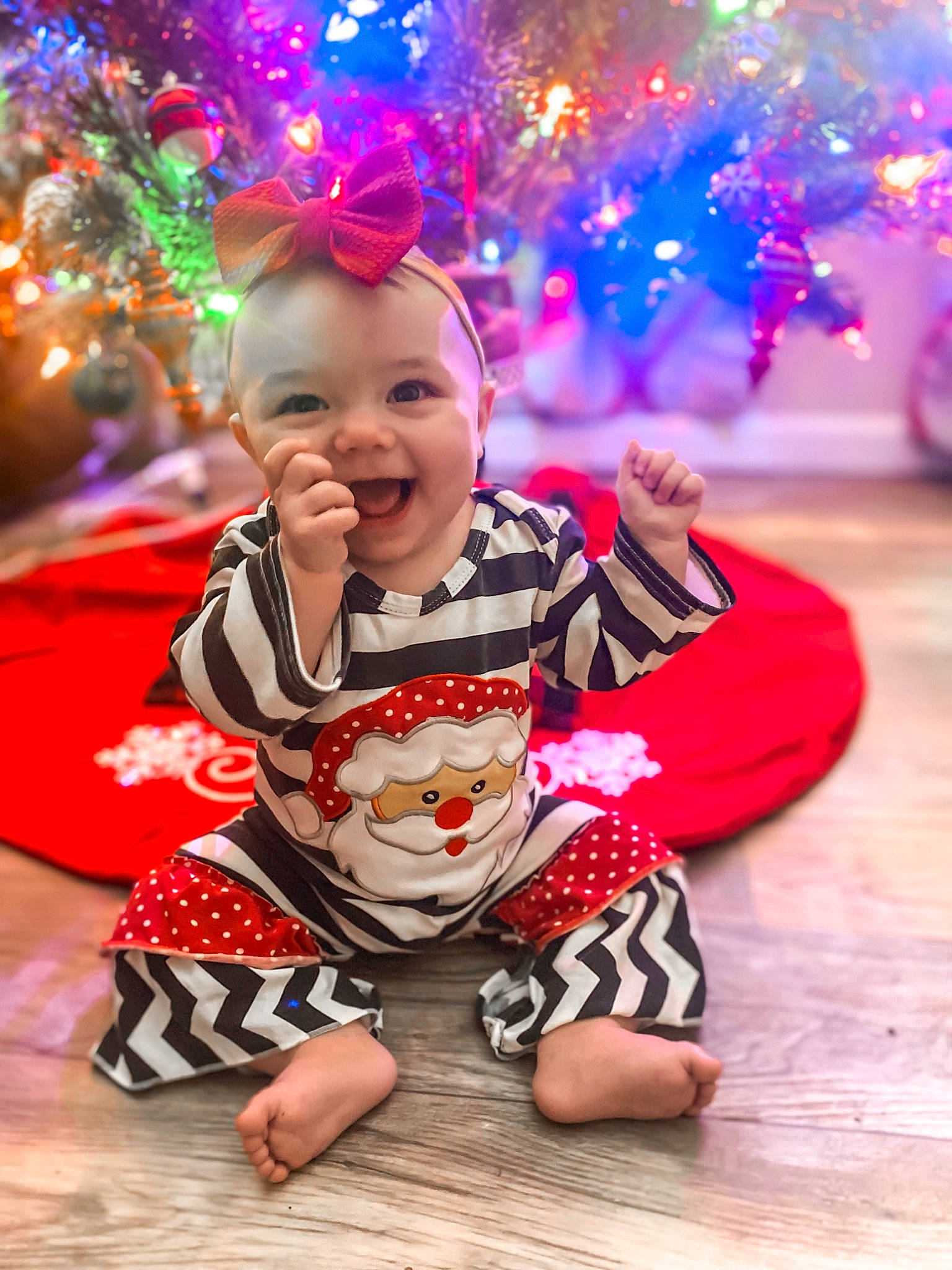 Emerie joined the competition — help win amazing prizes! baby_toddler_clothing, christmas_ornament, christmas_tree, eye, face, facial_expression, fun, happy, head, human_body, leisure, light, people, person, photograph, pink, red, smile, toddler, white