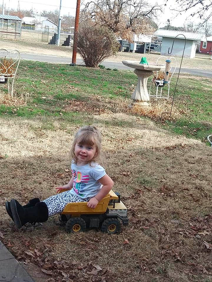 Evanee joined the competition — help win amazing prizes! backyard, child, grass, joy, lawn, outdoor_play_equipment, person, play, sitting, soil, toddler, tree, yard