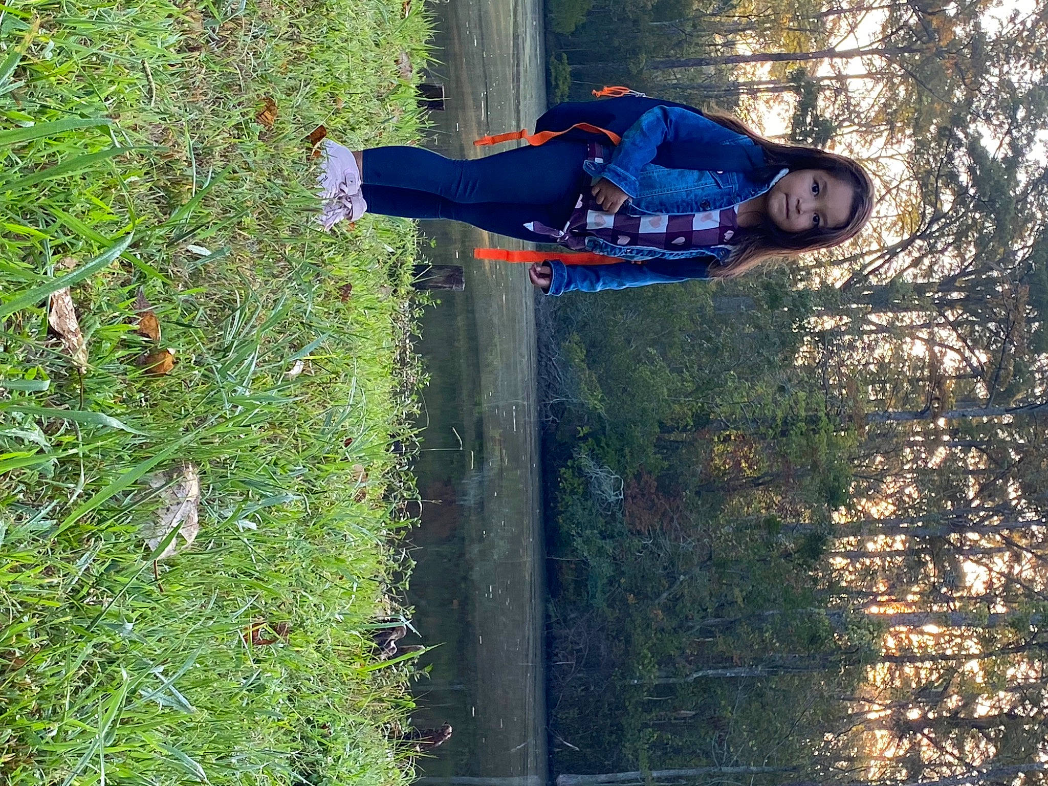 Mariana is registered to the contest to win money with this photo: electric_blue, forest, fun, grass, groundcover, landscape, leisure, people_in_nature, person, plant, recreation, shrub, tree, trunk, walking_shoe