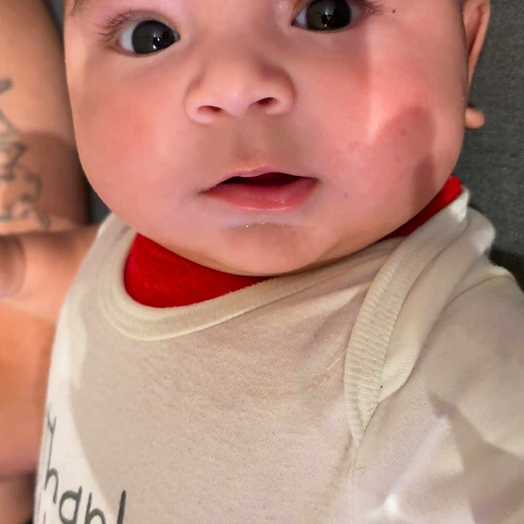 Carlos Yael joined the competition — help win amazing prizes! baby, child, clothing, cute, elephant, expression, eyes, face, head, indoors, infant, mouth, onesie, person, portrait, shadow, skin, soft_light, text, young