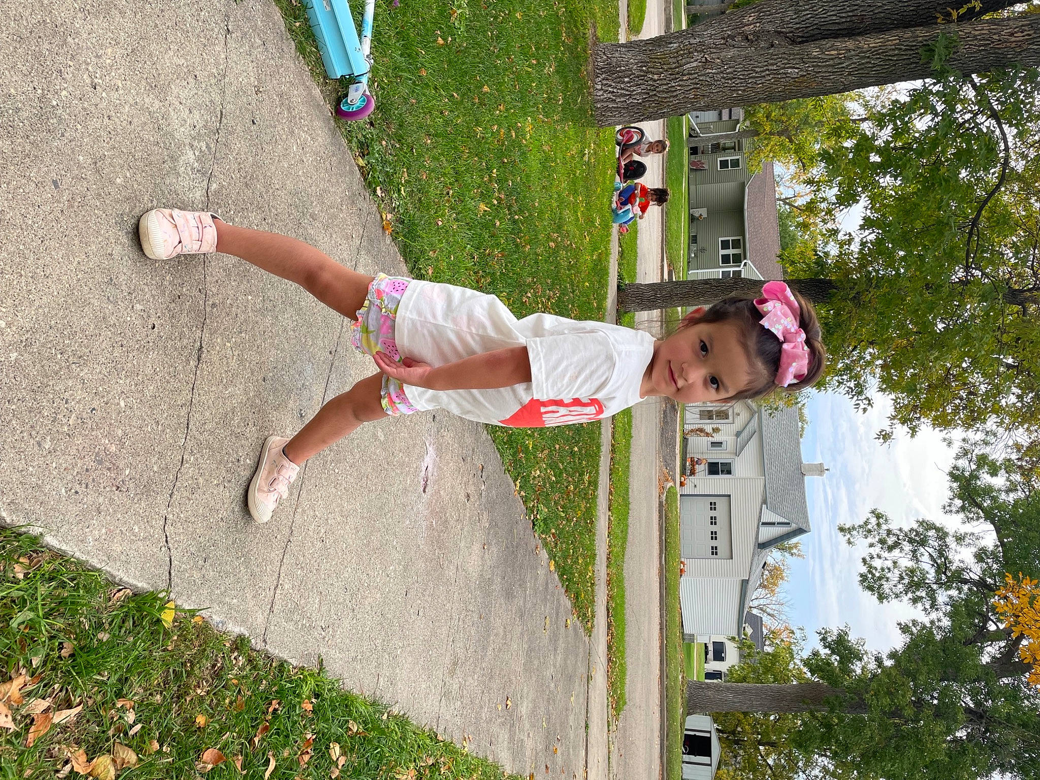 Belen is registered to the contest to win money with this photo: child, fun, grass, happy, hat, human_leg, joy, leisure, line, people_in_nature, person, plant, pole, recreation, shorts, sidewalk, sky, spring, thigh, toddler