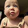 baby, beige_clothing, blue_eyes, buttons, child, chubby_cheeks, close_up, curious_expression, cute, face, head, human, indoor, infant, natural_light, person, portrait, skin, soft_light, young_child