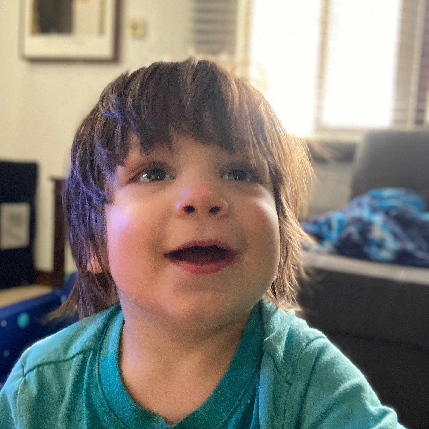 Deca joined the competition — help win amazing prizes! blue_shirt, blurred_background, casual_clothing, child, couch, cute, daylight, expression, face, furniture, happy, indoor, living_room, person, photograph, portrait, short_hair, smiling, toddler, window