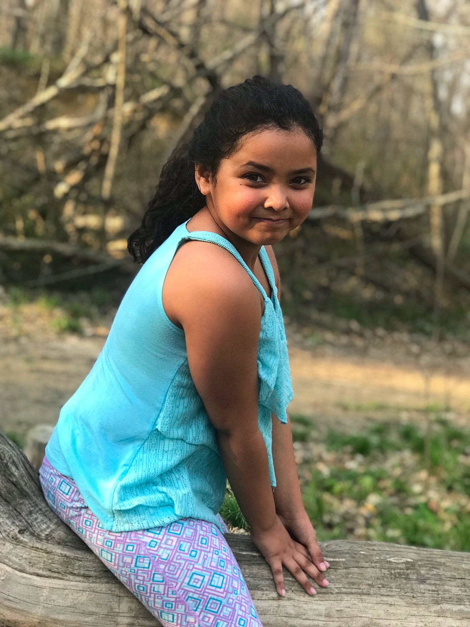 Eva is registered to the contest to win money with this photo: beauty, black_hair, child, child_model, fawn, forest, grass, green, joy, lady, long_hair, model, person, photo_shoot, photograph, photography, sitting, smile, tree, turquoise