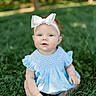 baby, child, girl, grass, outdoor, blue_dress, headband, bow, greenery, nature, sitting, portrait, cute, infant, summer, sunlight, happy, face, expression, young