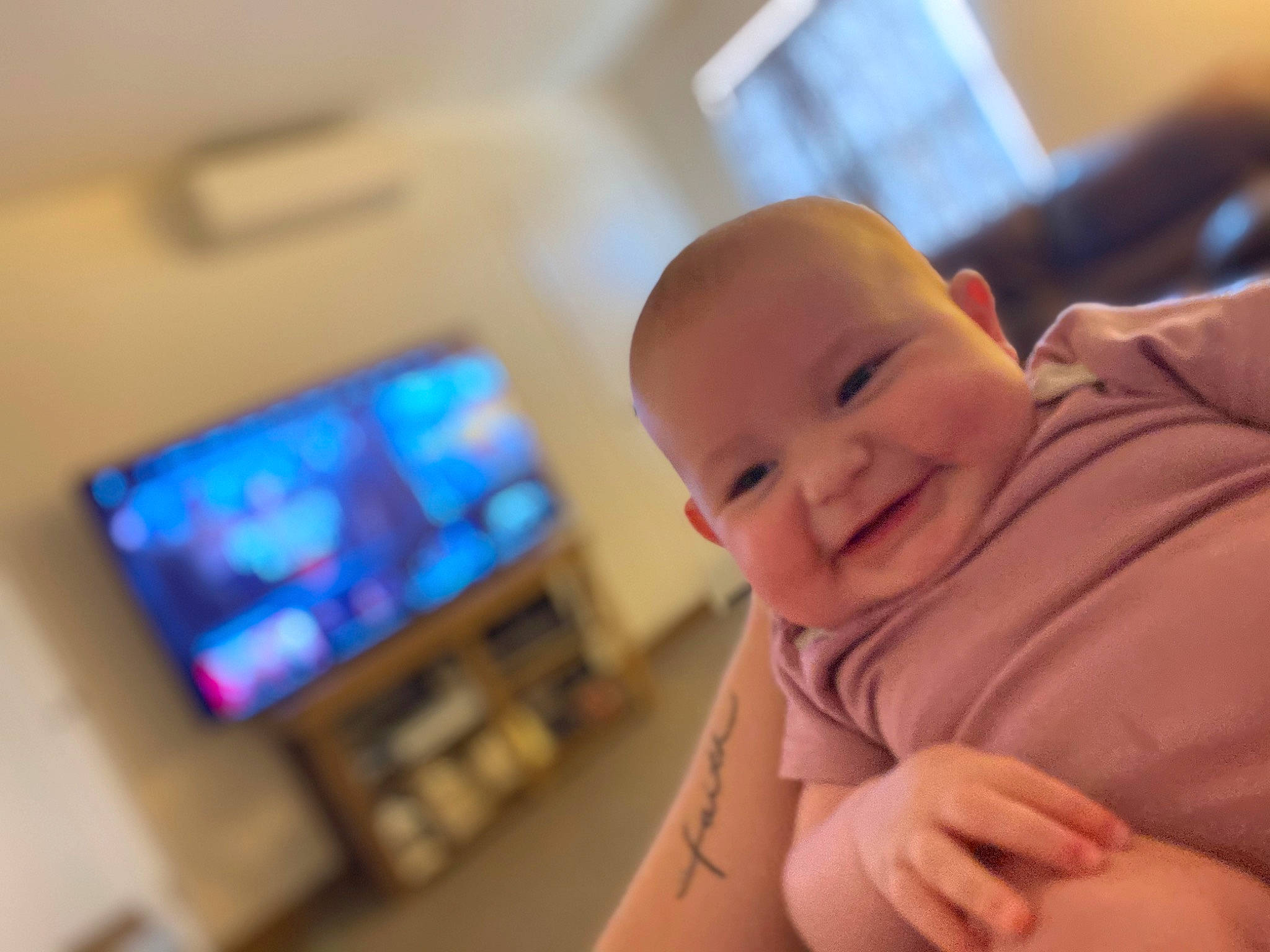 Emory Kate is registered to the contest to win money with this photo: audio_equipment, baby, baby_toddler_clothing, cheek, child, comfort, display_device, finger, flooring, fun, gadget, happy, joy, multimedia, person, room, sitting, sleeve, smile, thumb