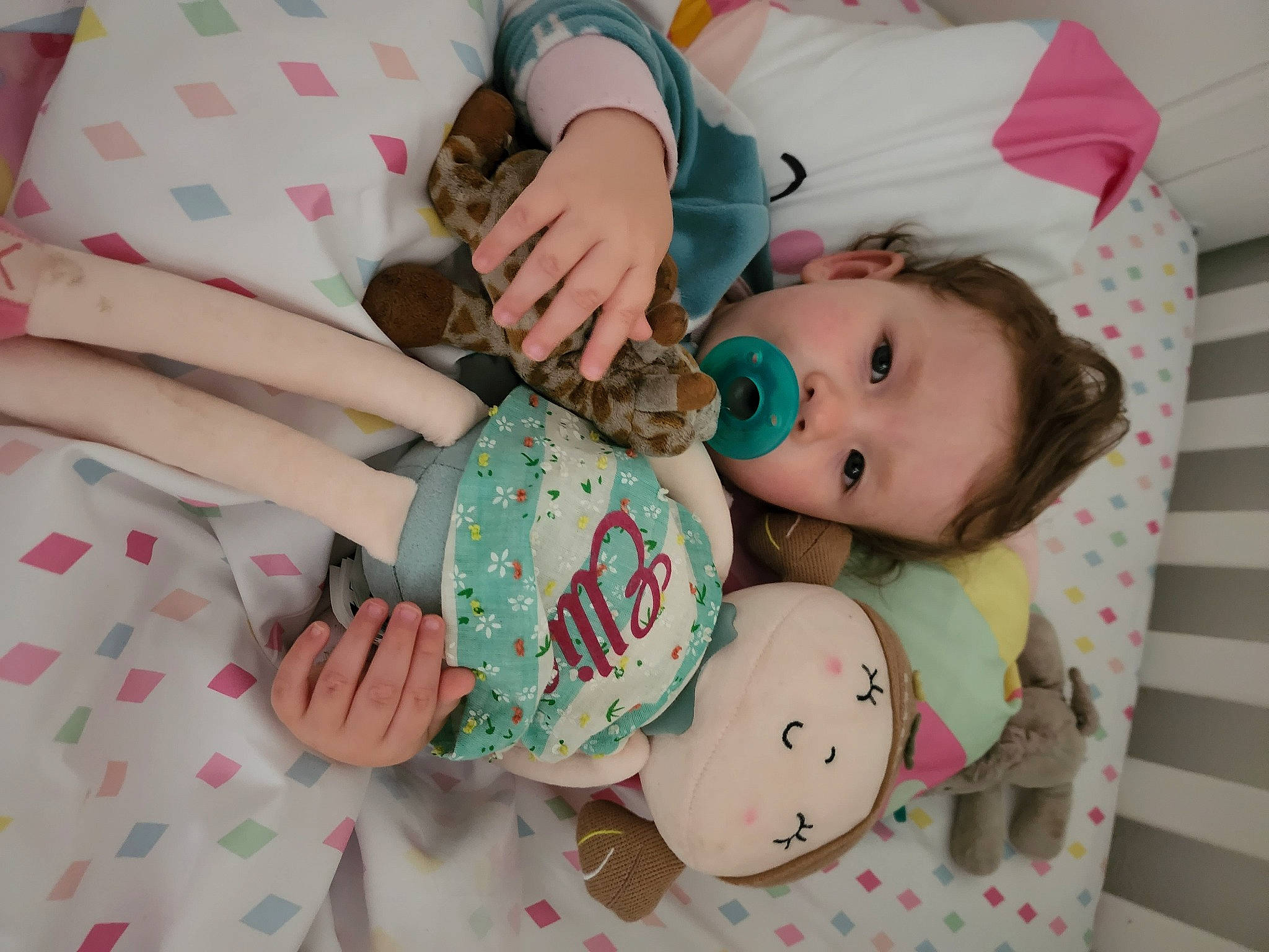 Elliana joined the competition — help win amazing prizes! baby, baby_products, baby_toddler_clothing, cheek, child, clothing, comfort, face, facial_expression, hand, linens, nail, pattern, person, pink, room, skin, textile, toddler, toy