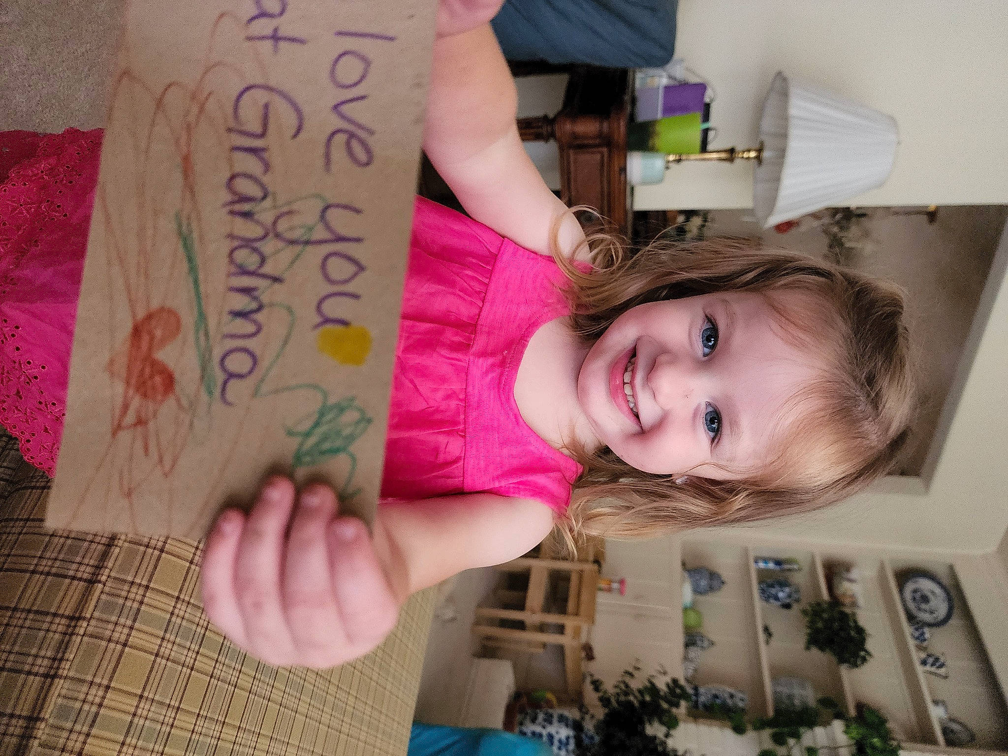 Veronica is registered to the contest to win money with this photo: arm, baby_toddler_clothing, child, facial_expression, finger, fun, hand, handwriting, happy, joy, magenta, nail, pattern, person, photograph, pink, room, skin, smile, t_shirt