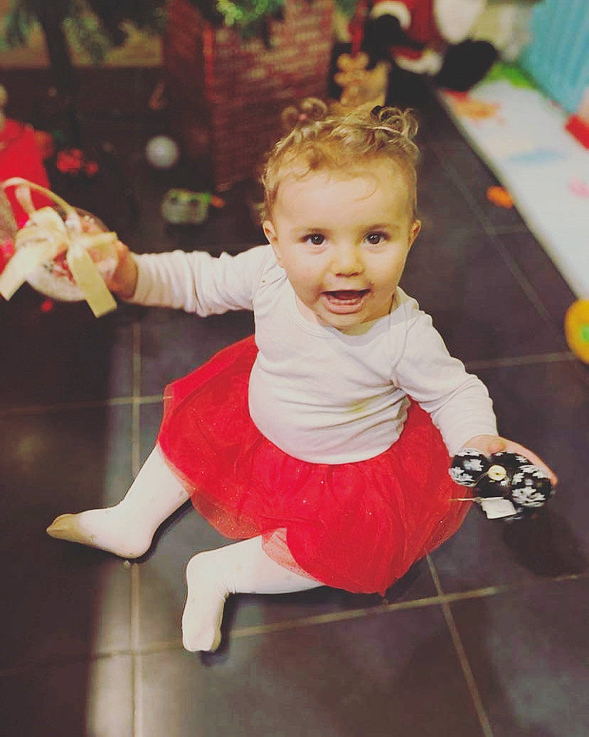 Chelsea participe au concours pour gagner de l'argent avec cette photo : baby_toddler_clothing, cheek, child, costume, event, facial_expression, floor, flooring, fun, gesture, happy, joint, leisure, person, pink, sitting, skin, sleeve, smile, standing