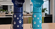 Linton joined the competition — help win amazing prizes! blue, branding, cat_logo, desk, hydration, indoor, lid, matching_pair, modern, office, paw_print, pet_accessory, pet_bottle, plastic, product_photography, strap, table, transparent, turquoise, water_bottle